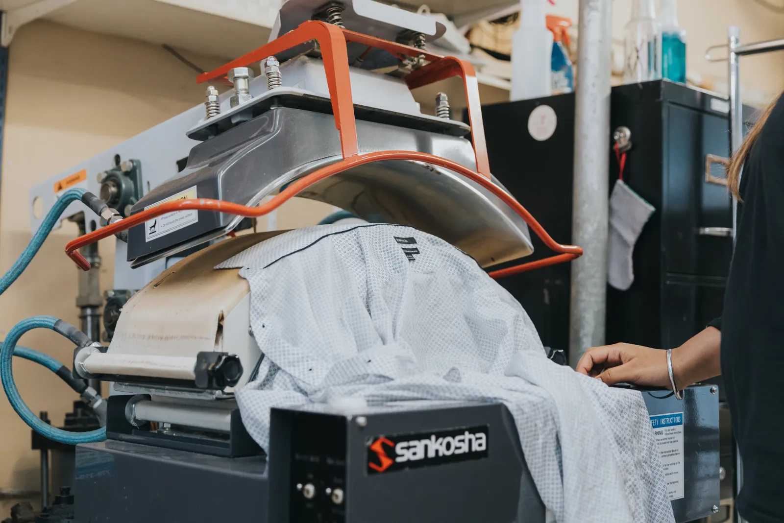 A dress shirt being finished on a Sankosha press at The Laundry Brothers facility.