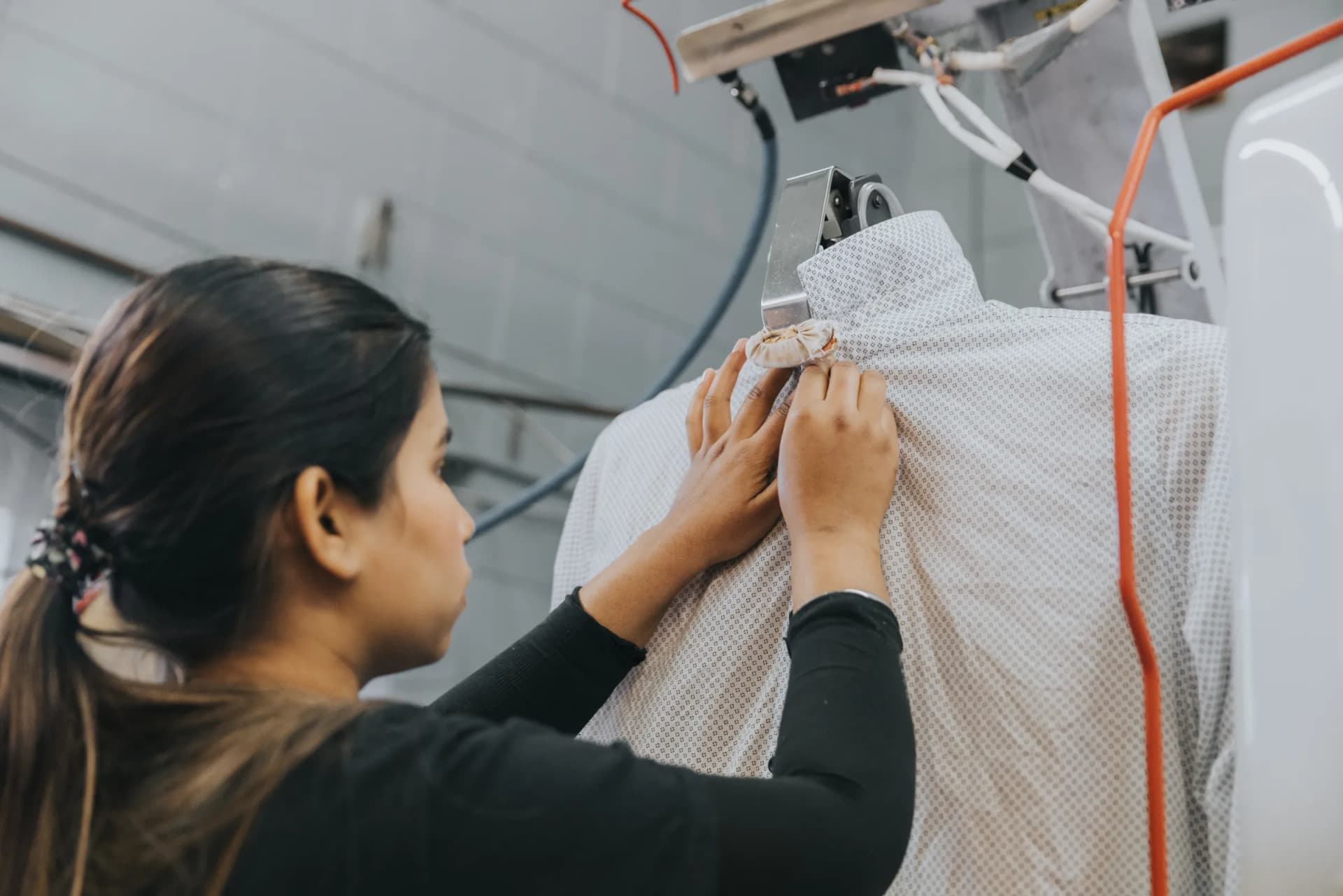 Freshly pressed garments on the rack — dry cleaning for busy professionals.